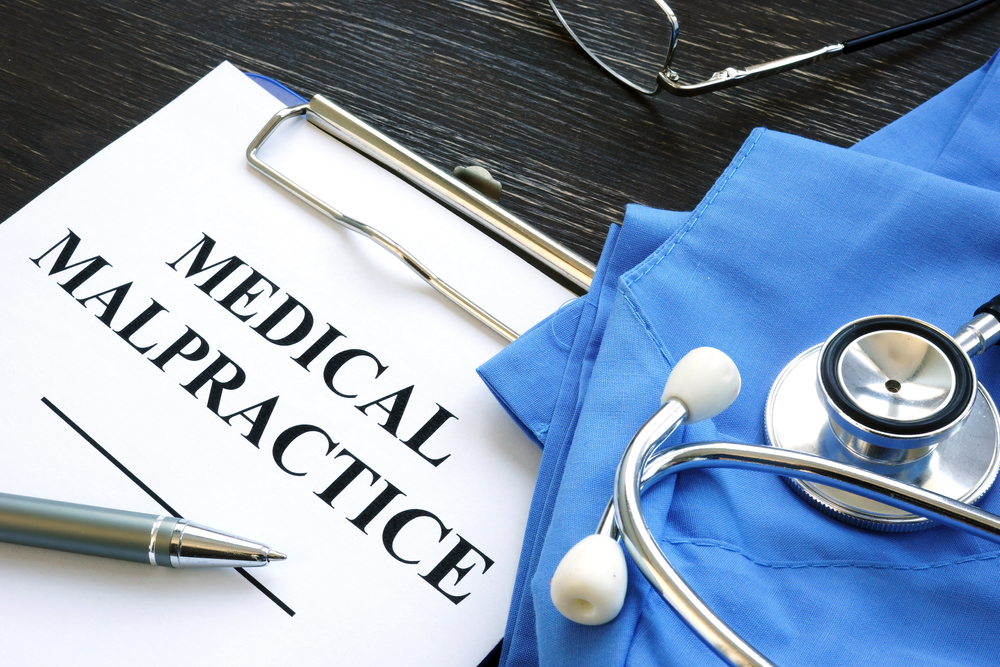 Medical malpractice. Medical suit, stethoscope and documents